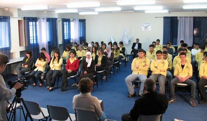 Global Family Chat 23_03_2009.013.jpg - Large group practice of Transcendental Meditation at Daburiya High School. Dr Tamir Elterman, at left, shoots footage to be used in a video montage by David Lynch during the Paul McCartney concert in  New York City.